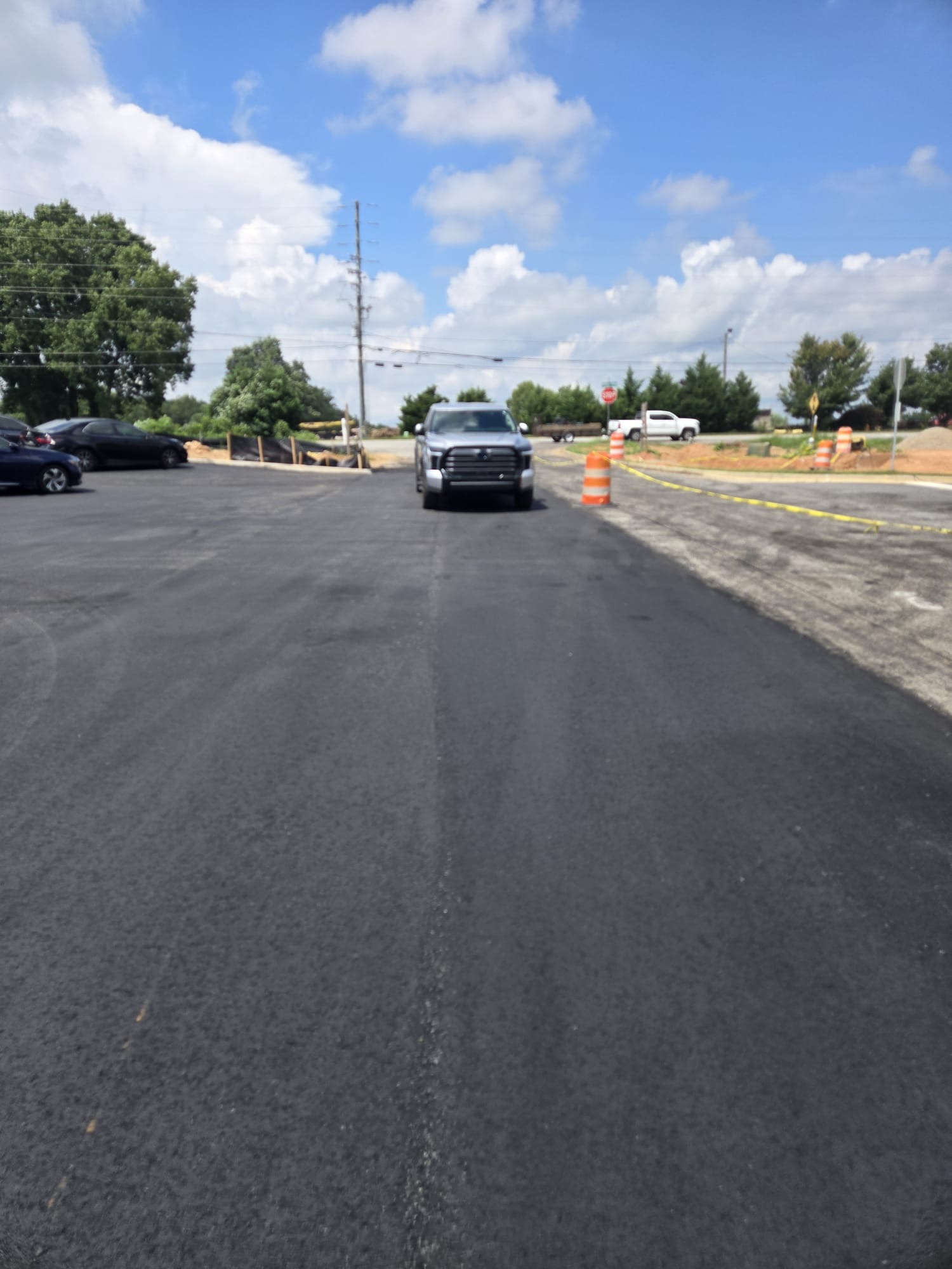 Newly paved driveway entrance and parking area
